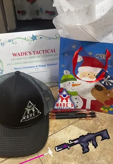 A Wade's Tactical License to Carry gift certificate with a branded hat and pens