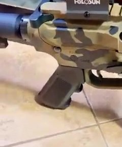 A pistol-caliber carbine with a Holosun red dot optic
