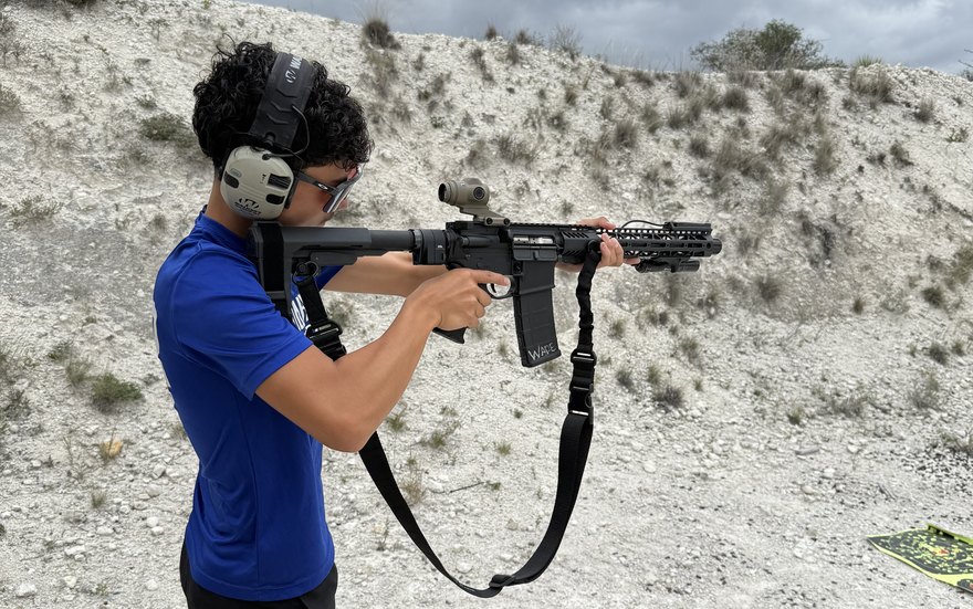 A young shooter on the line at an outdoor range near Del Rio, Texas